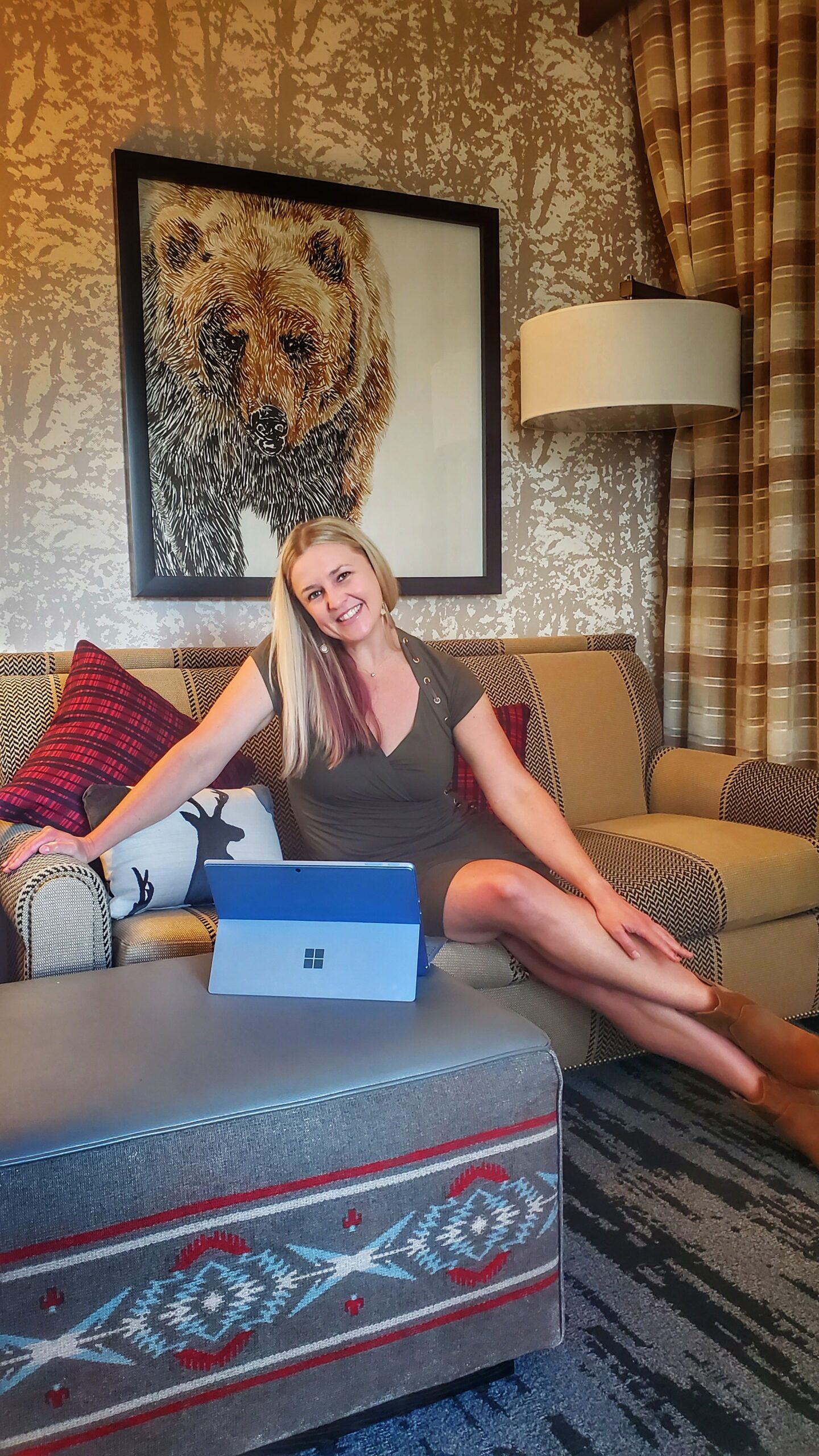 Work at hotel Woman sitting on coach and smiling